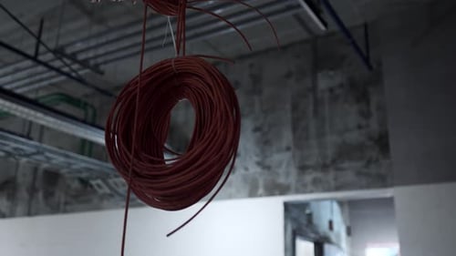 Roll of Wires Hanging in Unfinished Room