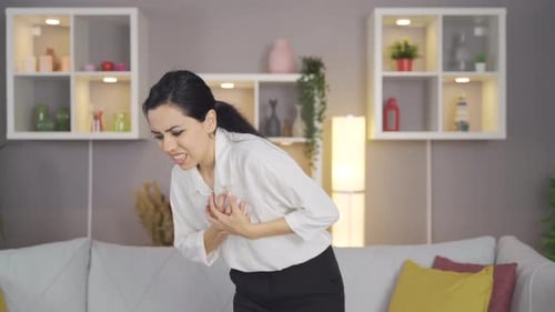 Woman having heart attack at home.