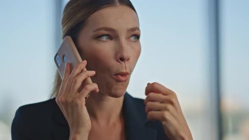 Excited Woman Talking Mobile Phone in Suit Office Employee Discussing Project