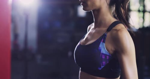 Woman Exercising and Sweating at the Gym