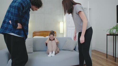Upset Child Caught in Parents' Conflict at Home