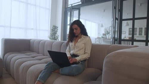 Portrait Of Young Woman Working Laptop Computer At Home Office In Slow Motion. Closeup Smiling Gi...