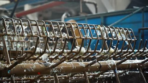 Special rotating machines on a waste recycling factory working with plastic garbage. Slow motion