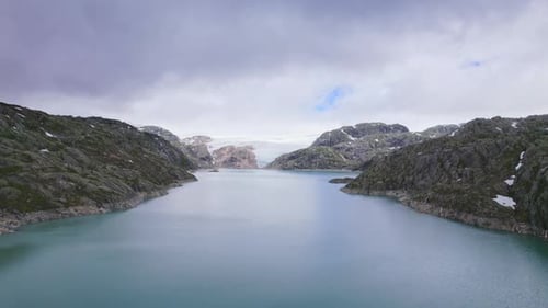 Drone Flight Over Majestic Norwegian Fjord Surrounded By Rocky Landscape