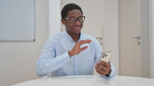 Man Video Calling Using Smartphone Indoors