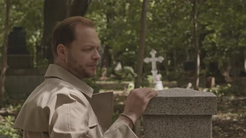 Man Mourning at Cemetery