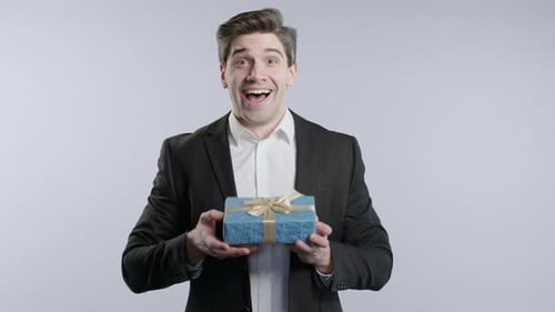 Handsome Businessman Boss Man Got Gift Present Box on White Office Background Mature 30s Aged Guy