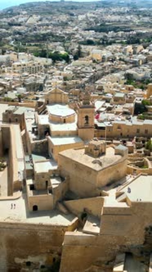 Aerial drone view of the Gozo island in Malta, in the Mediterranean Sea. Vertical vertical
