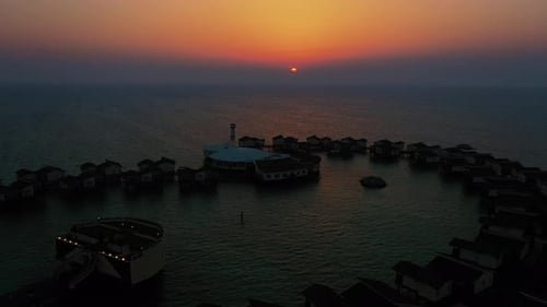 Luxury Resort Overwater Villas Illuminated by a Beautiful Sunset