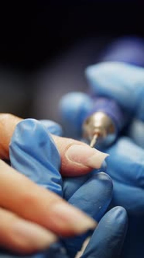 Cosmetic Nail Treatment Using Electric Nail File