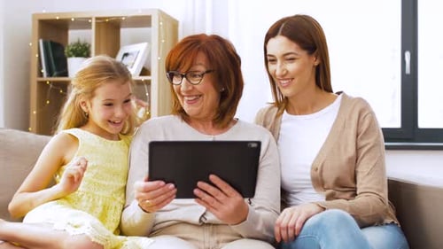 Grandmother, Mother, and Child Using Tablet Together