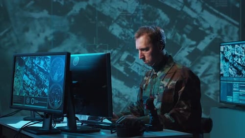Military Soldier Operating Advanced Technology in a Command Center