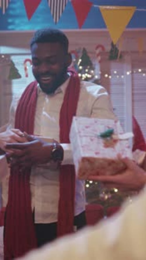 Friends Give Presents at Fun Christmas Party