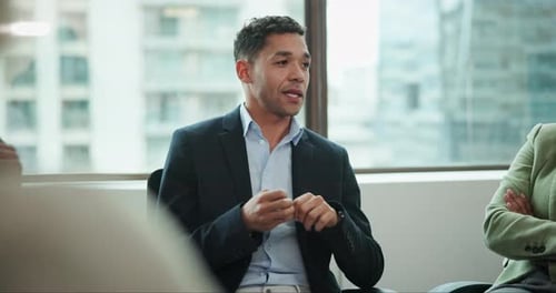 Man Speaking During Business Meeting in Modern Office