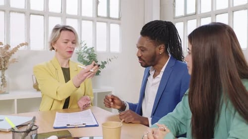 Business Meeting: Contract Signing in Modern Office