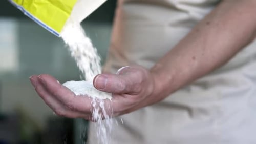 Flour Being Poured Into Hand