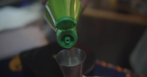Pouring Liquid Into Jigger for Cooking and Food Prep