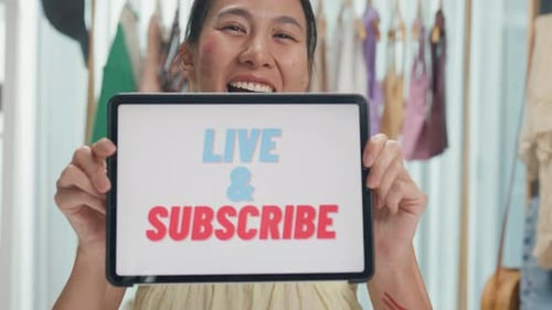 Asia lady beauty blogger wear crop top looking at camera use digital tablet show screen online live.