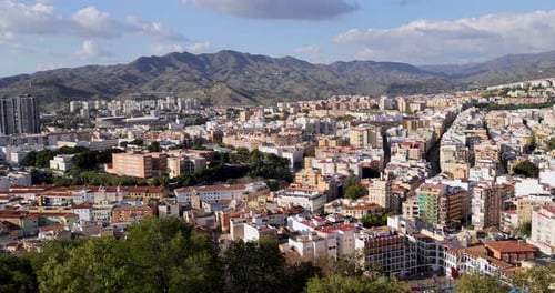 Footage of the streets of the city of Malaga in Spain showing an aerial view of the city centre with