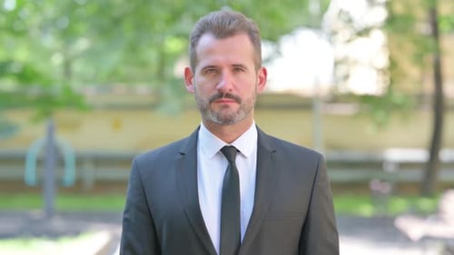 Serious Man in Suit Portrait Outdoors