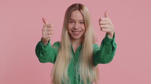 Smiling Woman Gives Two Thumbs Up Gesture