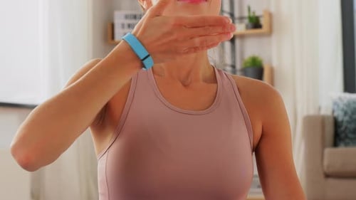 Woman Breathing Deeply in Bright Home Interior