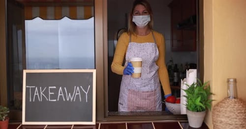 Young Woman Wearing Face Mask While Serving Takeaway Coffee Inside Bar Cafeteria Bar
