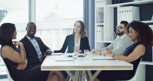 Diverse Group Meeting at Conference Table