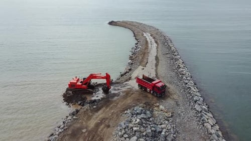 Truck Engineering Coastal Barrier Aerial. Coastal Barrier Building Process