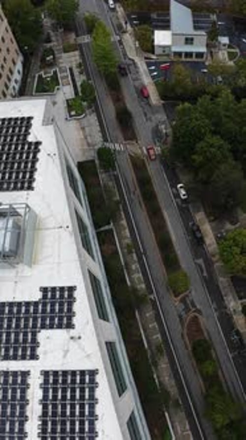 Vertical screen Aerial Downtown Street With Rooftop Solar Panels Tennessee Urban Corridor Featuring