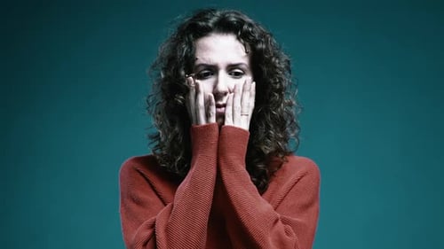 Distressed Woman Expressing Anxiety in Studio Close Up