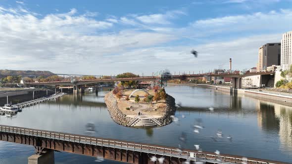 Aerial tilt up shot of Raspberry Island on Mississippi river at St Paul ...