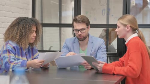 Collaborative Team Meeting in Bright Office