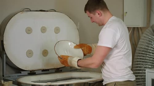 Potter in the Workshop Makes Pottery