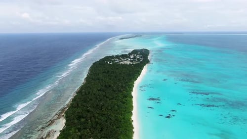 Aerial view of tropical beach and coral reef, Maldives.