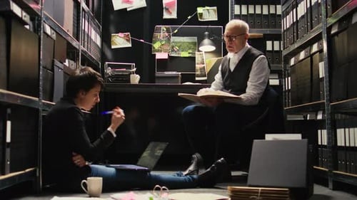 Investigators Working in Crowded Office Space