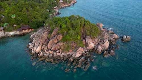 Stunning rotating drone flight over beautiful cliffs in tropical ocean