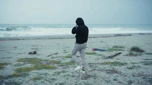 Man Arrives At The Sea During A Cold Winter Day