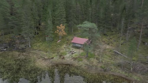 Isolated Aerial View Of A House Amidst Woodland In Norway.