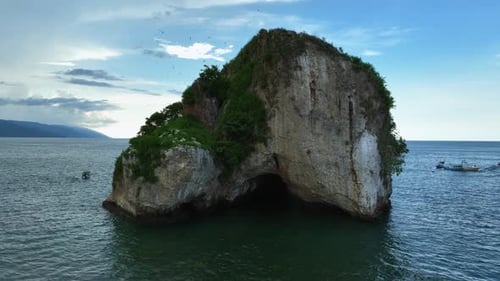 Aerial view circling Los Arcos de Mismaloya rock, in Puerto Vallarta, Mexico