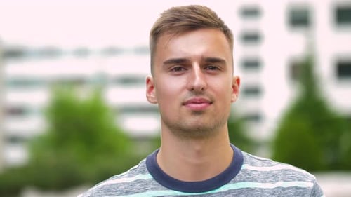 Man Smiles toward the Camera