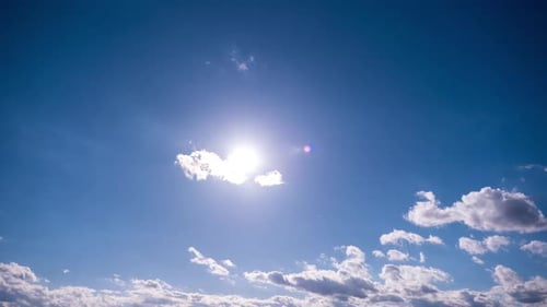 Clouds and Sun in the Blue Sky