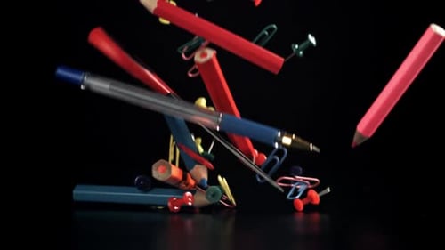 Various School Tools Fall on the Table Filmed on a Highspeed Camera at 1000 Fps