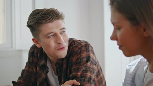 Engaging Conversation Between Man and Woman Indoors