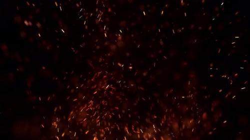 Glowing Embers Rising in Night Sky