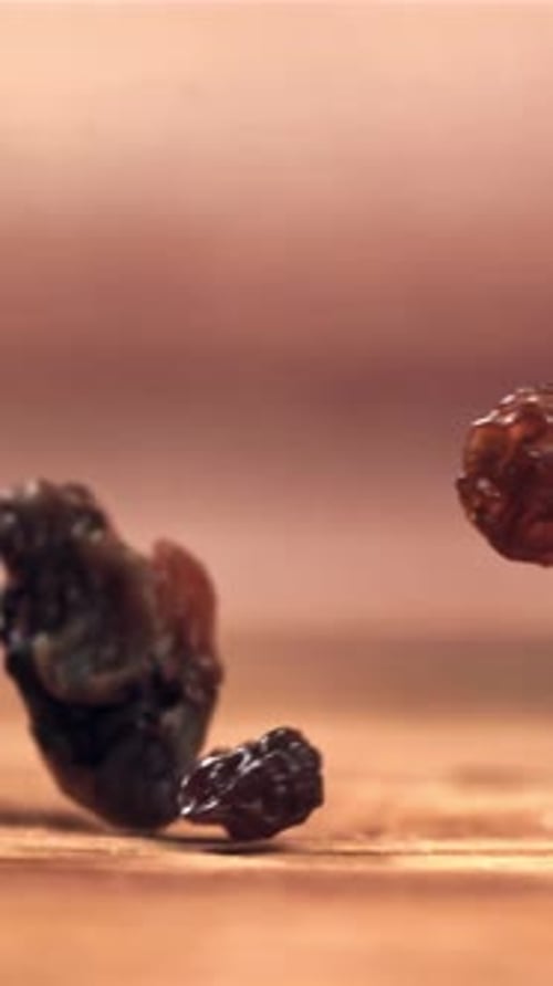 Raisins Fall on the Table Filmed on a Highspeed Camera at 1000 Fps