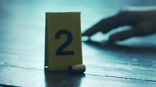 Evidence Marker and Bullet at Crime Scene
