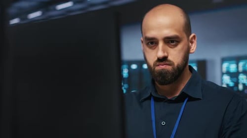 IT Worker Programming in Data Center Writing Code on PC