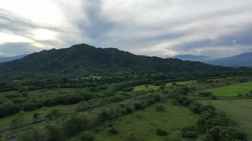 Aerial View of Rural Landscape With Green Mountain