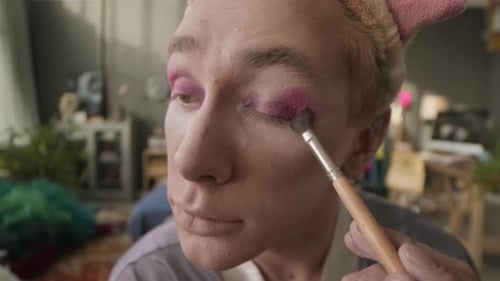 POV of Queer Man Applying Pink Eye Shadows